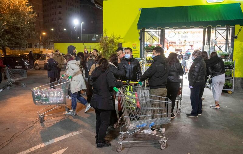 Roman citizens go to buy groceries at a supermarket in Rome, Italy.  EPA