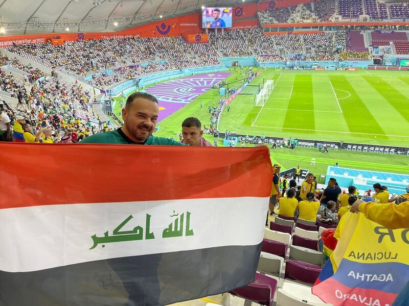 Dr Khayat holding the Iraqi flag