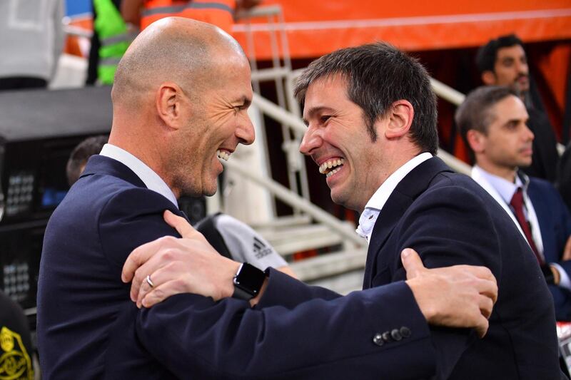 Zidane greets Valencia's Spanish coach Albert Celades. AFP