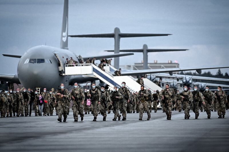 German soldiers leave a military plane after it landed at a base in Wunstorf, Germany, during the Nato evacuation operation from Kabul. EPA