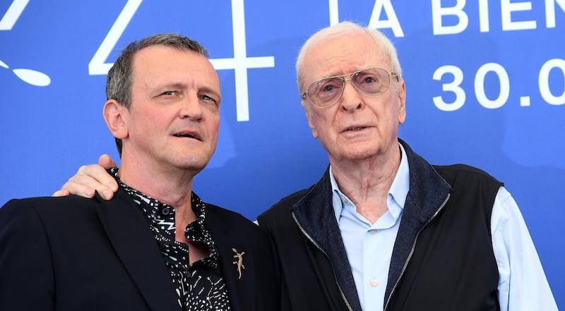 Director David Batty, left, and actor Michael Caine pose for photographers during the photo call of the film'My Generation. AP