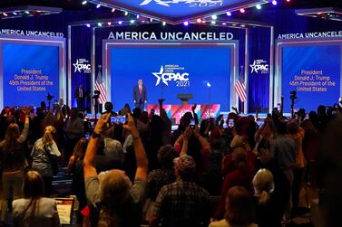 Supporters cheer and wave as former president Donald Trump is introduced at the Conservative Political Action Conference in Orlando in February. AP Photo