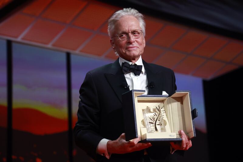 Michael Douglas receives the Honorary Palme d'Or during the opening ceremony of the 76th annual Cannes Film Festival on Tuesday. EPA