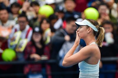 Maria Sharapova of Russia blows a kiss to the crowd after her victory over Mihaela Buzarnescu of Romania in the first round of the Shenzhen Open tennis tournament in Shenzhen, in China's southern Guangdong province on January 1, 2018. / AFP PHOTO / - / China OUT