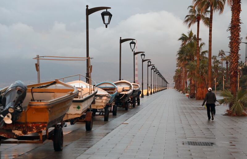 A person walks along Beirut’s empty seaside promenade. Reuters