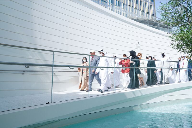 Sheikh Hamdan steps outside during his tour. The Monaco pavilion is located in the Opportunity district.
