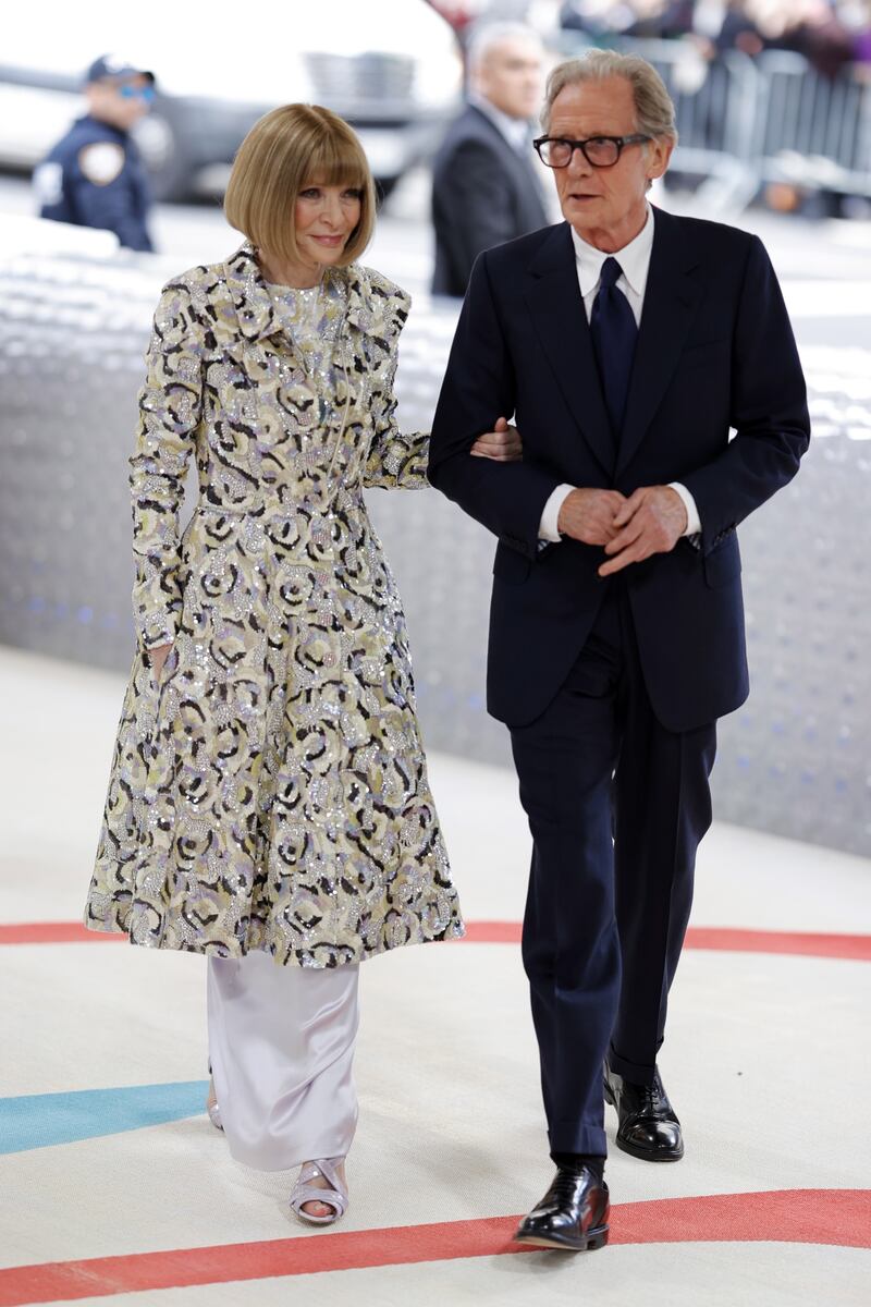 Anna Wintour in vintage Chanel, arrives with British actor Bill Nighy. EPA