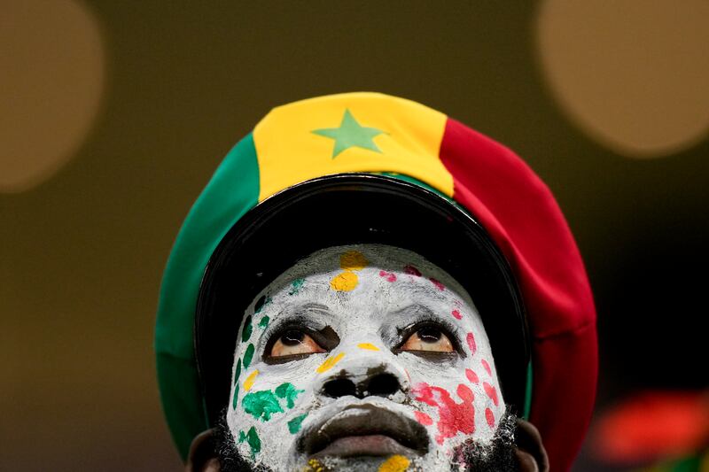 A Senegal fan waits for the start of the World Cup round of 16 soccer match between England and Senegal, at the Al Bayt Stadium in Al Khor, Qatar. AP Photo