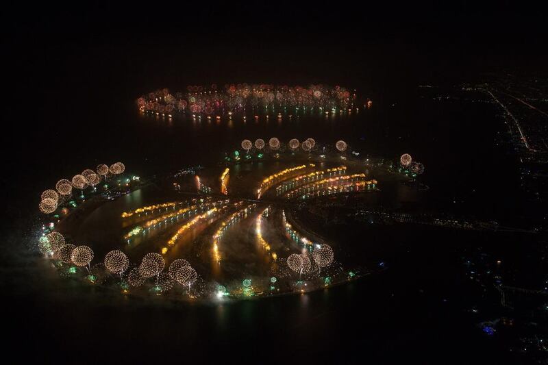 Fireworks going off over The Palm Jumeirah (foreground) and the islands of The World in the attempt to break the Guinness World Record for the 'Largest Firework Display'. Simon Brooke-Webb/Dubaiworldrecord2014