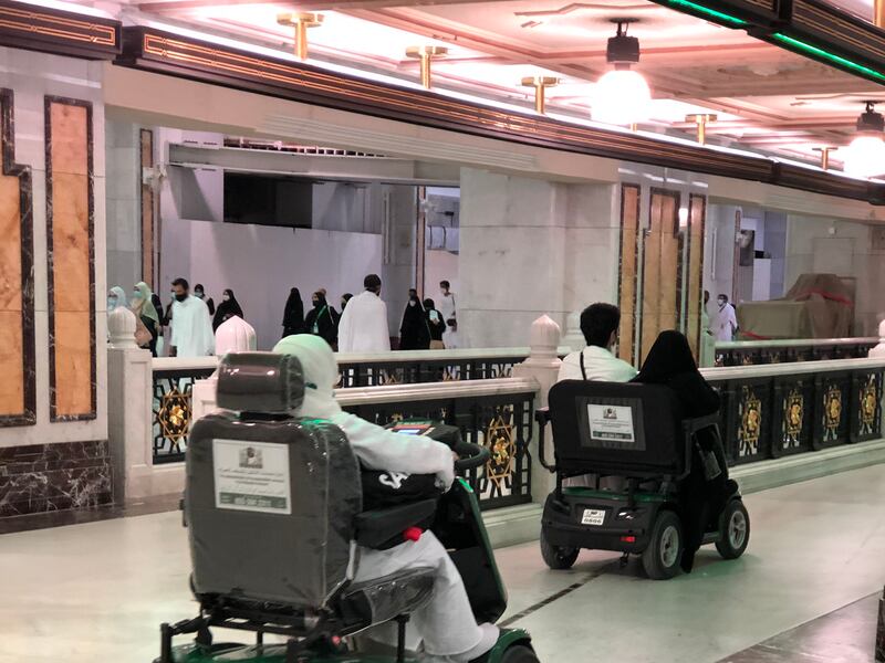 Mobility vehicles ferry pilgrims at the Grand Mosque.