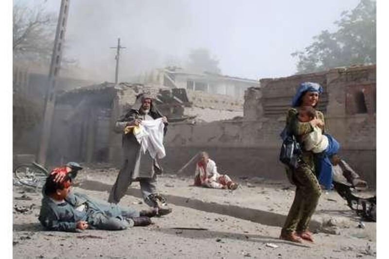 People flee the scene of the suicide attack on the Indian Embassy in Kabul yesterday.