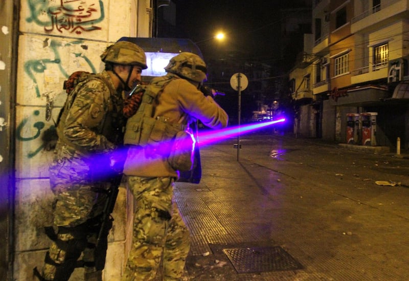 Army soldiers clash with demonstrators during a protest against the lockdown and worsening economic conditions, amid the spread of the coronavirus disease (COVID-19), in Tripoli, Lebanon. Reuters