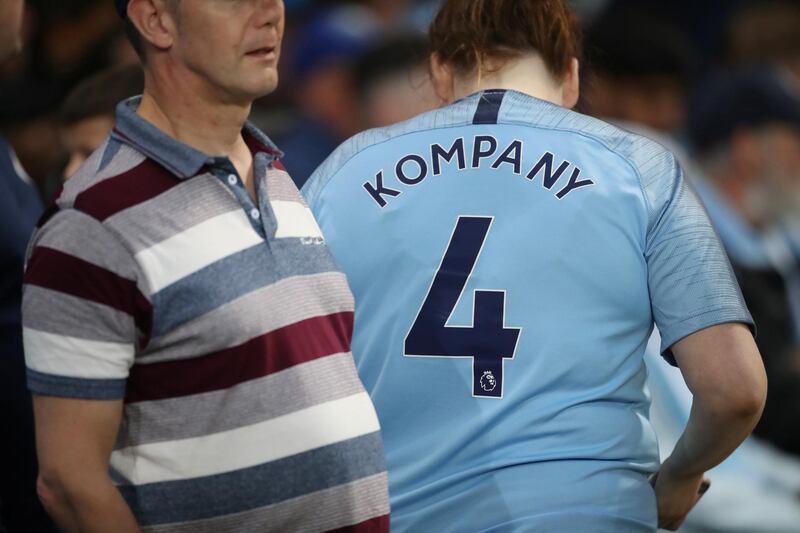 A Manchester City fan with a Vincent Kompany. Reuters