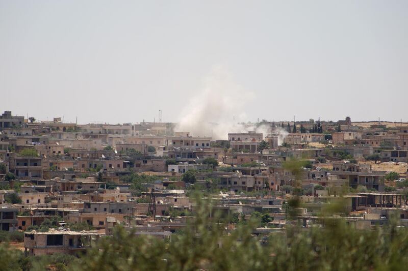 EDITORS NOTE: Graphic content / Smoke billows following reported bombardment by government forces in the Syrian northwestern town of Barah, in the Jabal al-Zawiya region of the rebel-held Idlib province on June 21, 2021. Syrian government shelling on the rebel-controlled enclave of Idlib killed at least nine people, including four civilians, a war monitor reported. / AFP / Abdulaziz KETAZ
