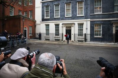 Photographers gather outside No 11 Downing Street as Rishi Sunak poses with his ministerial dispatch box. Bloomberg