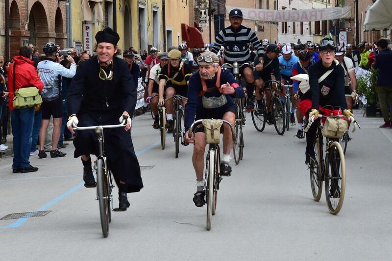 Cyclists ride during L'Eroica Sud, a retro cycling event in Buonconvento, near Siena. Competitors wearing vintage cycling jerseys and riding vintage bicycles took part in L'Eroica Sud, riding through the 'Strade Bianche', the gravel roads of the Chianti area of Tuscany. Giuseppe Cacace / AFP Photo