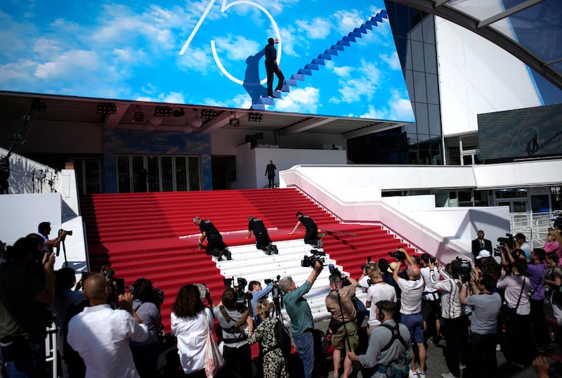 Crew members install the red carpet at the Palais des Festivals, ahead of the opening day of the 75th Cannes Film Festival. AP Photo
