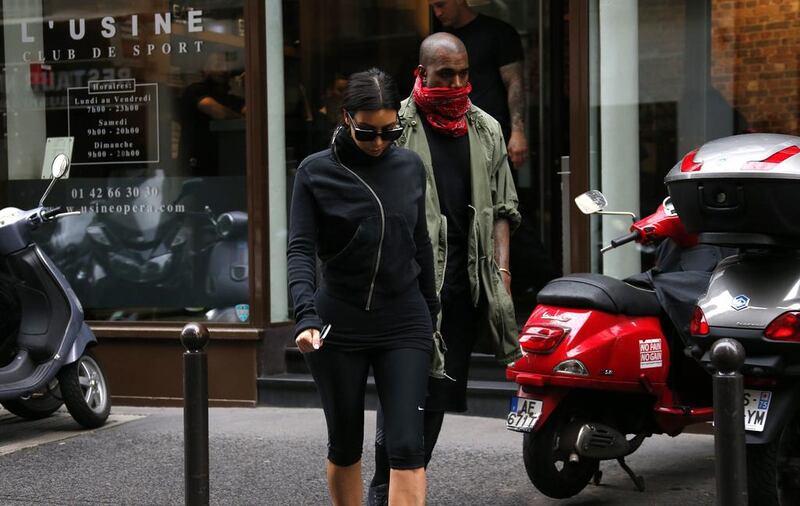 Kim Kardashian and Kanye West leave a fitness club in Paris on May 21, 2014. Gonzalo Fuentes / Reuters