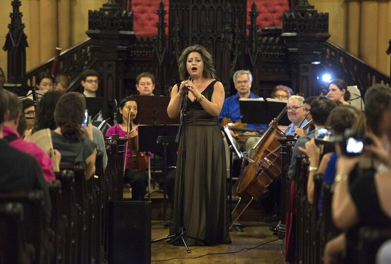 Lubana Al Quntar, a Syrian opera singer who was granted asylum in the United States, sings with the Refugee Orchestra Project on World Refugee Day in New York on June 20, 2016. Dom Emmert / AFP
