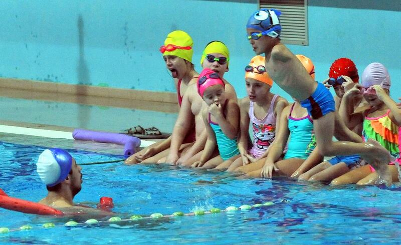 Bosnian swim coach Amel Kapo trains disabled children at Sarajevo’s Olympic swimming pool facility on November 22, 2016. Elvis Barukcic / AFP