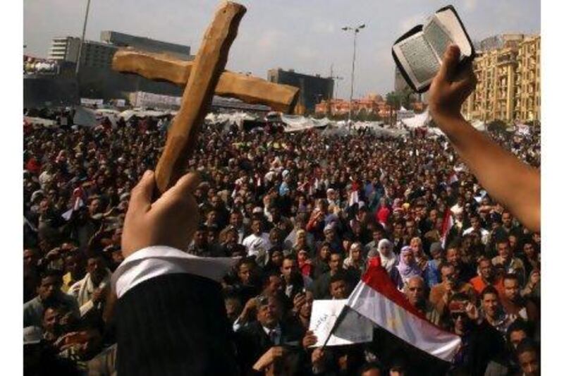 A cross and a Quran are held up during demonstrations earlier this year in Cairo's Tahrir Square. A reader praises the centuries-old ethnic and religious diversity of the Middle East. Schaib Salem / Reuters