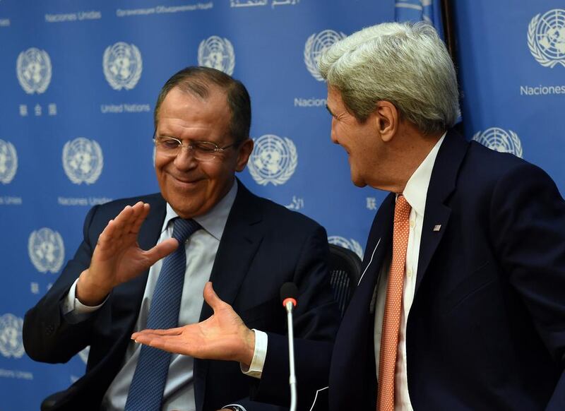 Foreign minister of Russia Sergey Lavrov and US secretary of state John Kerry shake hands after a news conference after a UN Security Council meeting on Syria. Timothy A Clary /  AFP 

