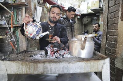 Hussein's tea stall is the last stop before pilgrims enter the shrine. His decorative porcelain teapots are imported from Iran and he makes sure to keep them piping hot for the chattering customers who flock to his hearth needing a boost of energy. Leila Molana-Allen for The National