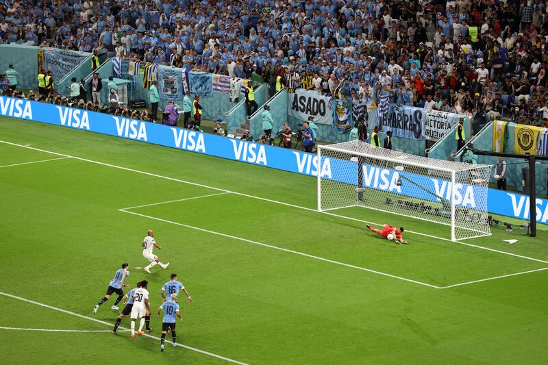 Uruguay's Sergio Rochet saves Andre Ayew's penalty. Getty