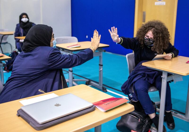 Abu Dhabi, United Arab Emirates, March 3, 2021.  Pupils receive some of their IGCSE and International A-level results for January session 2021. Pupils celebrating after recieving receiving results.
Victor Besa / The National
Section:  NA
Reporter:  Anam Rizvi