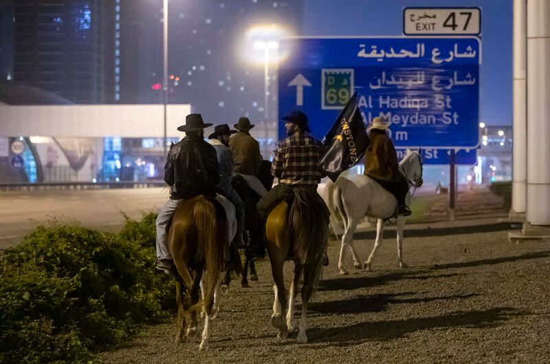 Cowboys sauntering down Sheikh Zayed Road is no regular occurrence. Photo: Ruel Pableo for The National