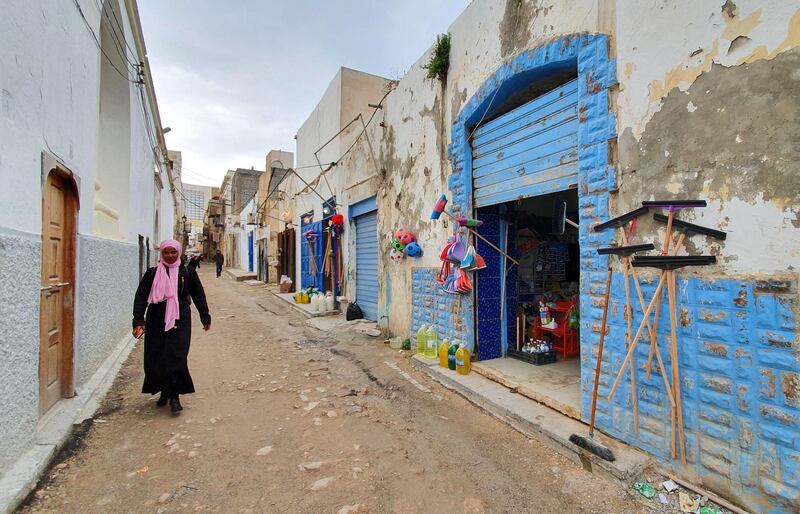 A woman walks in Libya's capital Tripoli, controlled by the UN-recognised Government of National Accord (GNA). Residents of Libya's capital have received news of a ceasefire with a mix of relief and scepticism after more than nine months of deadly fighting on the edges of Tripoli. AFP