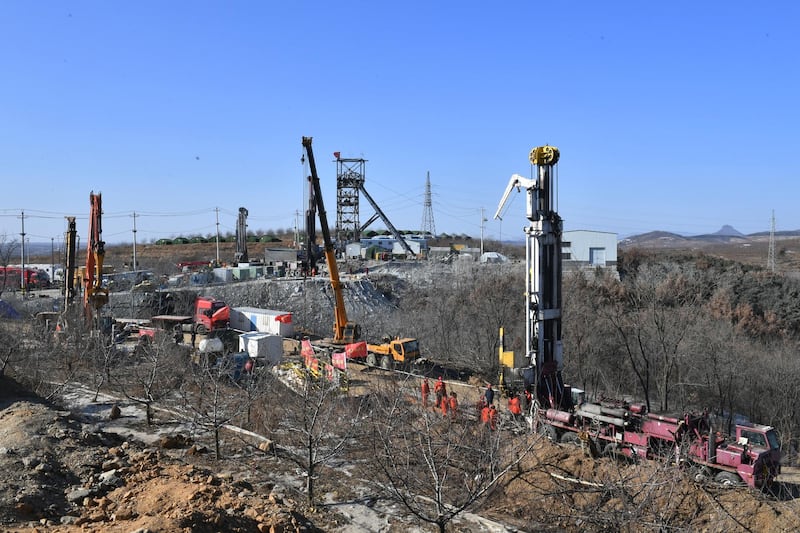 Rescuers work in the aftermath of an explosion at a gold mine site in Qixia city, Shandong province, China. Around 22 workers have been trapped underground after an explosion ripped through the gold mine on 10 January 2021. EPA