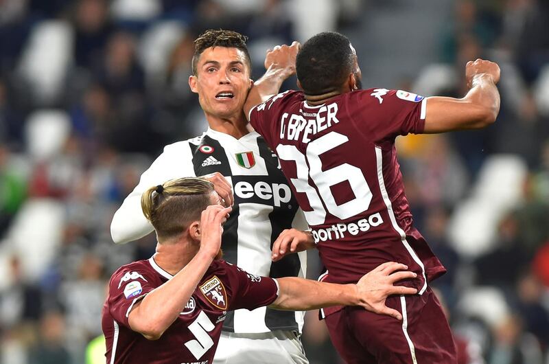 Juventus' Cristiano Ronaldo in action with Torino's Bremer during Friday's Serie A match in Turin. The match ended in a 1-1 draw. Reuters
