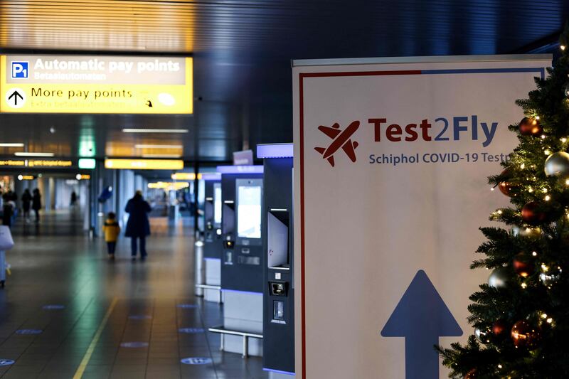 A sign points the way to a Covid-19 test centre at Schiphol Airport in the Netherlands. AFP