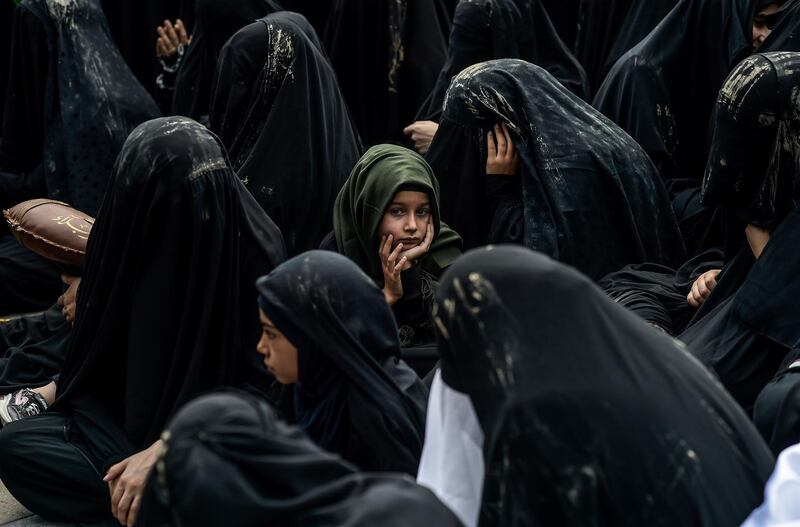 Turkish Shiite women take part in a religious procession held for the Shiite religious holiday of Ashura in Istanbul.  AFP