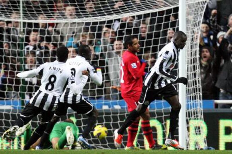Newcastle forward Demba Ba celebrates his goal against Wigan.