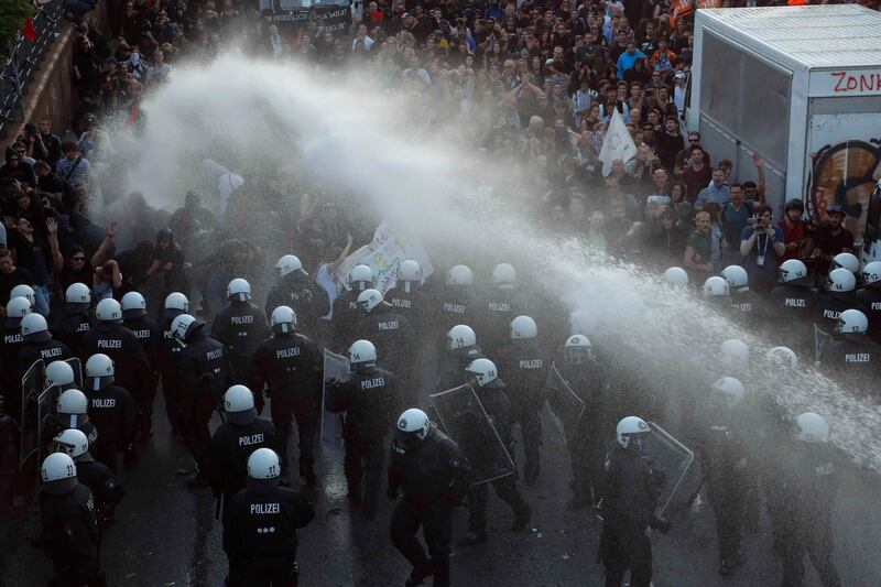 German riot police use water cannons against protesters during the demonstrations during the G20 summit in Hamburg, Germany