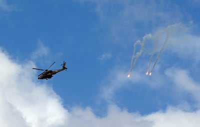An Israeli Apache attack helicopter fires a missile during Monday's raid in the occupied West Bank city of Jenin. EPA 