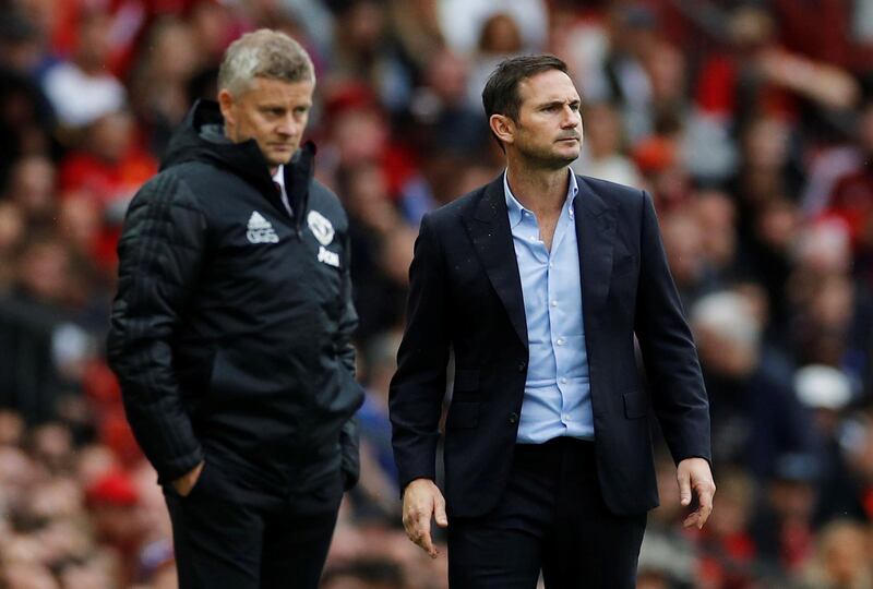 Soccer Football - Premier League - Manchester United v Chelsea - Old Trafford, Manchester, Britain - August 11, 2019  Manchester United manager Ole Gunnar Solskjaer and Chelsea manager Frank Lampard look on  REUTERS/Phil Noble  EDITORIAL USE ONLY. No use with unauthorized audio, video, data, fixture lists, club/league logos or "live" services. Online in-match use limited to 75 images, no video emulation. No use in betting, games or single club/league/player publications.  Please contact your account representative for further details.