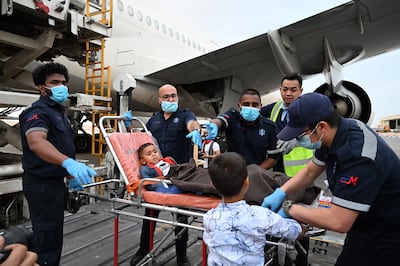 Four year-old Thabet is prepared for boarding the Etihad flight to Abu Dhabi on Friday at Al Arish military airport in Egypt. He has a broken hip and burns on both his legs as a result of an Israeli strike on the UN school where he was playing with friends. Wam