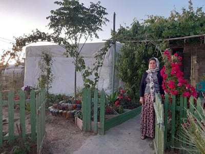 Khoki Hasso Silo in her garden in Domiz 1 Camp, Kurdistan, northern Iraq. Produce from her garden has helped sustain the family during the coronavirus lockdown. Via Lemon Tree Trust