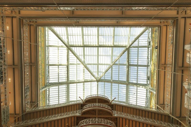 Wrought-iron balconies and banisters stand on the grand staircase beneath the glass roofed atrium of the Samaritaine department store, operated by LVMH Moet Hennessy Louis Vuitton, during ongoing renovation work in Paris, France, on Tuesday, Nov. 19, 2019. The world’s biggest luxury group LVMH, controlled by billionaire Bernard Arnault--is set to reopen the Samaritaine department store next April after 15 years. Photographer: Laura Stevens/Bloomberg