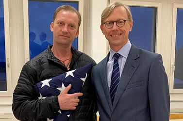 Michael White, a freed US Navy veteran detained in Iran since 2018, poses with US Special Envoy for Iran Brian Hook at Zurich Airport on Thursday. Reuters