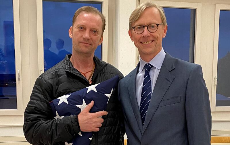 Michael White, a freed U.S. Navy veteran detained in Iran since 2018, poses with U.S. Special Envoy for Iran Brian Hook while on his return to the United States at Zurich Airport in Zurich, Switzerland June 4, 2020.  U.S. State Department/Handout via REUTERS. THIS IMAGE HAS BEEN SUPPLIED BY A THIRD PARTY. THIS IMAGE WAS PROCESSED BY REUTERS TO ENHANCE QUALITY, AN UNPROCESSED VERSION HAS BEEN PROVIDED SEPARATELY.