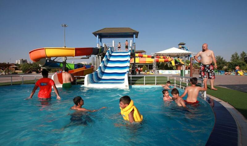 Young Iraqi boys cool themselves at the Aquatic City waterpark in Erbil, Iraq. Ahmed Jalil / EPA
