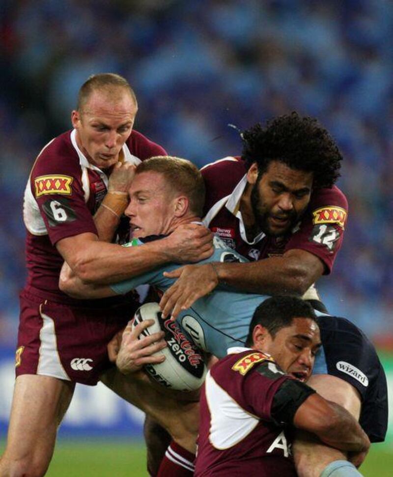 Ben Creagh of NSW is tackled by the Maroons defence during game two of the State of Origin series.