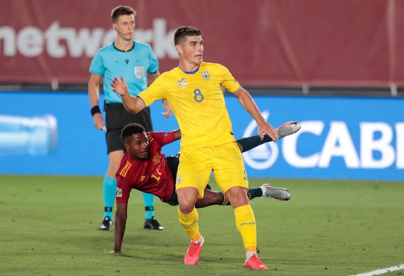 Ansu Fati falls to the turf as he scores Spain's third goal against Ukraine. AP Photo