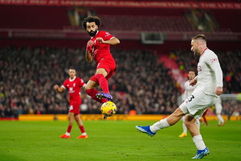 Liverpool's Mohamed Salah tries to block a pass by Manchester United's Luke Shaw. AP