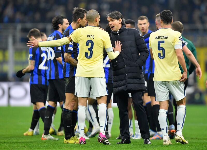 Inter Milan coach Simone Inzaghi clashes with Porto's Pepe and Ivan Marcano. Reuters