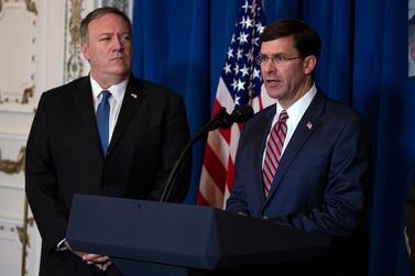 US Secretary of State Mike Pompeo, left, listens as Secretary of Defence Mark Esper delivers a statement on American air strikes in Iraq and Syria at President Donald Trump's Mar-a-Lago retreat in Florida. AP Photo